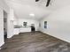 Bright kitchen featuring white cabinets, stainless steel appliances, granite countertops, and modern flooring at 4903 Jamee Dr, Gastonia, NC 28056