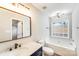 Bathroom featuring a tub, modern vanity with gold hardware, and vinyl flooring at 5417 Timbertop Ln, Charlotte, NC 28215
