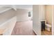 Bedroom featuring carpeted floors, a window, and a partial view of the adjacent bathroom at 5417 Timbertop Ln, Charlotte, NC 28215