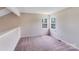 Bedroom featuring carpeted floors and two windows, providing plenty of natural light at 5417 Timbertop Ln, Charlotte, NC 28215