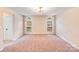 Spacious carpeted bedroom featuring two arched windows for plenty of natural light at 5417 Timbertop Ln, Charlotte, NC 28215