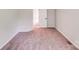 Bedroom featuring carpeted floors, neutral walls, and a view into the adjacent room at 5417 Timbertop Ln, Charlotte, NC 28215