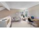 Cozy room with a desk, chair, shelving, and natural light from two windows at 5417 Timbertop Ln, Charlotte, NC 28215