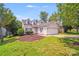 Charming home featuring dormer windows, well-maintained landscaping, and an attached two-car garage at 5417 Timbertop Ln, Charlotte, NC 28215