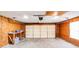This garage features a workbench, overhead lighting, and an automatic garage door opener at 5417 Timbertop Ln, Charlotte, NC 28215