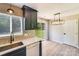 Well-lit kitchen featuring sleek countertops, modern appliances, and stylish lighting at 5417 Timbertop Ln, Charlotte, NC 28215