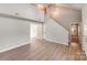 Spacious living area with high ceilings, wood floors, and ample natural light create an inviting and open space at 5417 Timbertop Ln, Charlotte, NC 28215