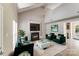 Chic living room with vaulted ceilings, a sleek fireplace, and stylish green accents create a sophisticated space at 5417 Timbertop Ln, Charlotte, NC 28215