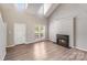 Inviting living room with high ceilings, a cozy fireplace, and natural light at 5417 Timbertop Ln, Charlotte, NC 28215