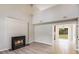 Bright living room featuring a modern fireplace and access to the outdoor space through sliding glass doors at 5417 Timbertop Ln, Charlotte, NC 28215