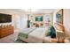Serene main bedroom features arched windows, a calming color palette, and a plush bed for ultimate relaxation at 5417 Timbertop Ln, Charlotte, NC 28215