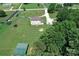 Aerial view of a home with expansive lawn, mature trees, and a shed in a private setting at 550 Baker Mill Rd, Cleveland, NC 27013