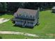 Spacious two-story home with a welcoming front porch and a generous lawn at 550 Baker Mill Rd, Cleveland, NC 27013