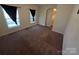 Cozy bedroom featuring plush carpeting, natural light, and easy access to the rest of the home at 550 Baker Mill Rd, Cleveland, NC 27013