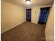 Inviting bedroom with plush carpet and window treatments, bathed in natural light at 550 Baker Mill Rd, Cleveland, NC 27013
