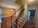 Inviting entryway featuring hardwood floors, a staircase, and views into the dining and living areas at 550 Baker Mill Rd, Cleveland, NC 27013
