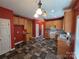 Expansive kitchen with ample storage, updated cabinets, and a stylish brick backsplash at 550 Baker Mill Rd, Cleveland, NC 27013