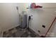 A utilitarian space featuring an updated water heater and practical shelving for storage solutions at 550 Baker Mill Rd, Cleveland, NC 27013