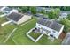 Aerial shot displaying the backyard, patio setup, white fencing, and nearby residential homes at 6340 Ziegler Ln # 148-A, Charlotte, NC 28269
