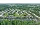 Community aerial view showing houses nestled among lush trees, streets, and neighborhood layout at 6340 Ziegler Ln # 148-A, Charlotte, NC 28269