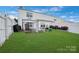 Spacious backyard featuring a well-maintained lawn, a gazebo and a flower bed at 6340 Ziegler Ln # 148-A, Charlotte, NC 28269