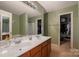 Large bathroom with double sink vanity, soaking tub, and separate shower at 6340 Ziegler Ln # 148-A, Charlotte, NC 28269