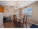 Elegant dining room with stylish chandelier, seating for eight, and a convenient wine cooler at 6340 Ziegler Ln # 148-A, Charlotte, NC 28269