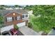 Aerial view of a two-story home with a well-manicured lawn, two-car garage, and landscaped front yard at 6340 Ziegler Ln # 148-A, Charlotte, NC 28269