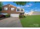 Charming two-story home with a well-manicured lawn, two-car garage, and landscaped front yard at 6340 Ziegler Ln # 148-A, Charlotte, NC 28269