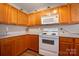 Well-lit kitchen with classic cabinetry, updated appliances, and a cozy atmosphere at 6340 Ziegler Ln # 148-A, Charlotte, NC 28269