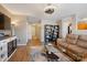 Comfortable living room features hardwood floors, decorative shelving, and comfortable sofa at 6340 Ziegler Ln # 148-A, Charlotte, NC 28269