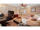 Open living room with a comfortable sectional, office space, and lots of natural light at 6340 Ziegler Ln # 148-A, Charlotte, NC 28269