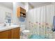 Functional bathroom with a floral shower curtain and coordinating blue accents at 6601 Charlotte Hwy, York, SC 29745