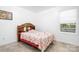 Cozy bedroom featuring a wooden headboard and a window for natural light at 6601 Charlotte Hwy, York, SC 29745