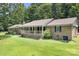 Charming brick ranch home with a large porch and lush lawn, perfect for outdoor living at 6601 Charlotte Hwy, York, SC 29745