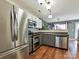 This kitchen is designed with stainless steel appliances, granite countertops, and ample cabinet space at 7024 Sunman Rd, Charlotte, NC 28216