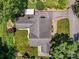 Aerial view of a home with a large roof, well-kept lawn, and detached carport at 747 9Th Nw St, Hickory, NC 28601