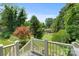 A view from the porch, overlooking the backyard, showcasing mature trees and landscaping at 747 9Th Nw St, Hickory, NC 28601