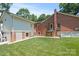 Brick home exterior with manicured lawn and landscaping in the backyard of the property at 747 9Th Nw St, Hickory, NC 28601