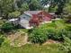 Charming backyard features a deck, mature trees, and an expansive manicured lawn at 747 9Th Nw St, Hickory, NC 28601