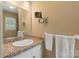 Bathroom vanity with mosaic tile backsplash, large mirror, and white sink at 747 9Th Nw St, Hickory, NC 28601
