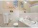 Bathroom with white tile, modern fixtures, and ample lighting at 747 9Th Nw St, Hickory, NC 28601