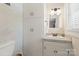 Bathroom featuring storage, white cabinets, and a granite-look countertop at 747 9Th Nw St, Hickory, NC 28601