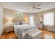 Bright bedroom features hardwood floors, ceiling fan, and access to the porch at 747 9Th Nw St, Hickory, NC 28601
