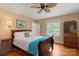 Bedroom with hardwood floors, ceiling fan, and natural lighting at 747 9Th Nw St, Hickory, NC 28601