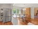 Cozy breakfast nook with stainless steel fridge, a marble-top breakfast bar and a charming round table with chairs at 747 9Th Nw St, Hickory, NC 28601
