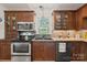 Well-equipped kitchen featuring stainless steel appliances, dark cabinets, and a sleek black double-basin sink at 747 9Th Nw St, Hickory, NC 28601