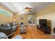 Comfortable living room with hardwood floors, gray sofa, and a view into the adjacent room via glass-paned door at 747 9Th Nw St, Hickory, NC 28601