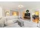 Inviting living room with plush seating, ottoman, and a stylish entertainment center beneath a modern television at 747 9Th Nw St, Hickory, NC 28601