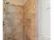 Tiled shower stall featuring large, neutral-toned tiles and a handheld shower head at 747 9Th Nw St, Hickory, NC 28601